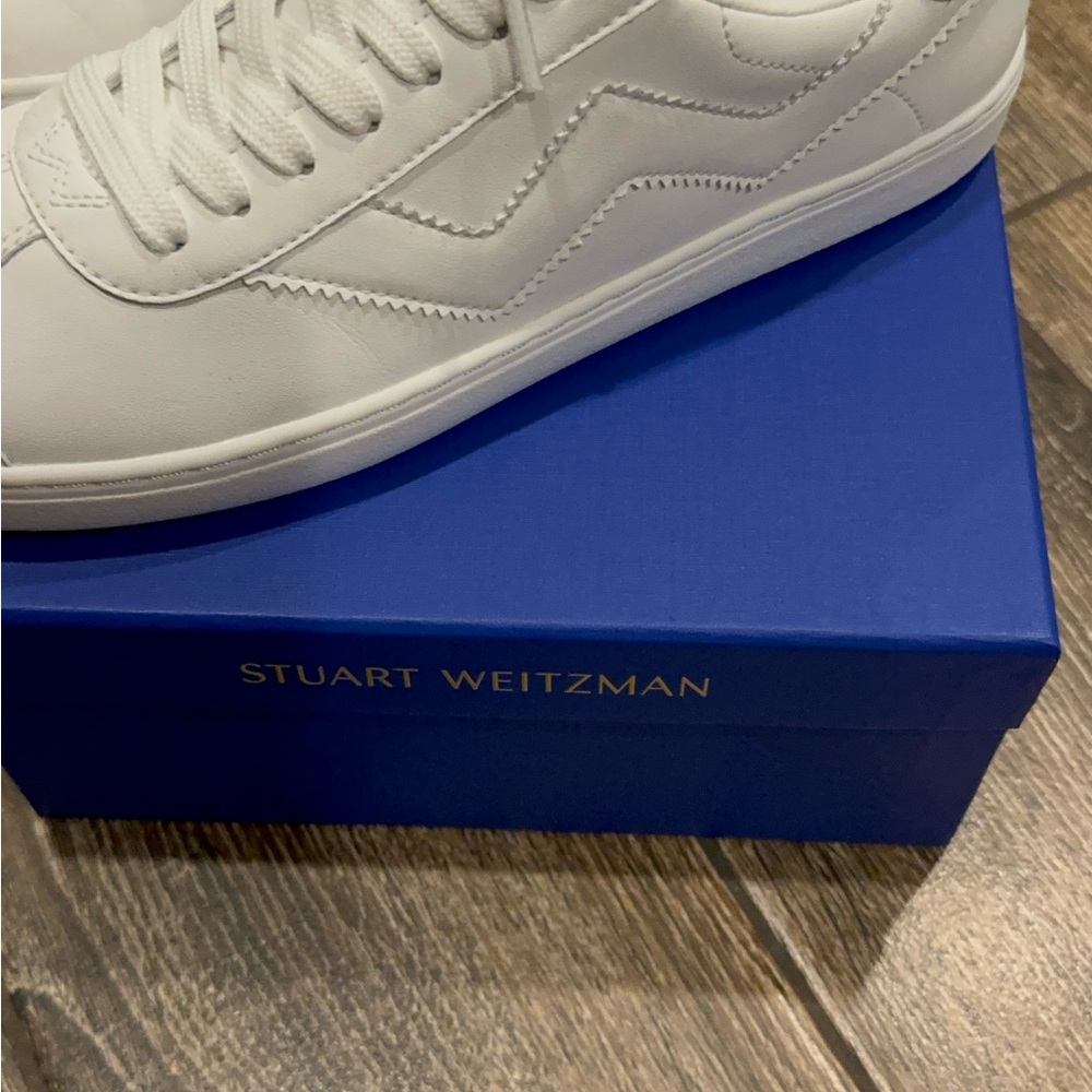 Stuart Weitzman white Daryl sneakers.